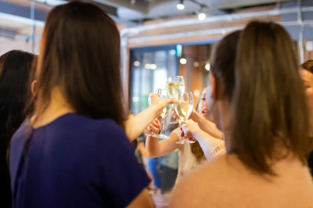 Colleagues raising their glasses in a toast